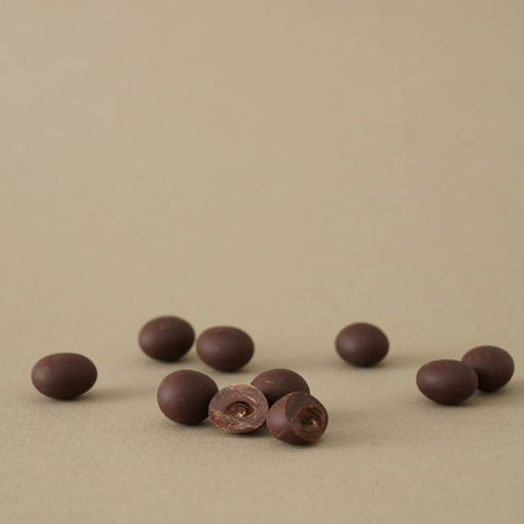 Roasted coffee beans covered with 55% chocolate